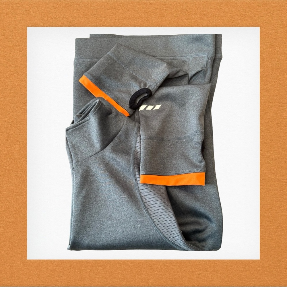 Women’s 1/4 zip Orange Theory pullover. Gray XL. Orange, silver, black accents.